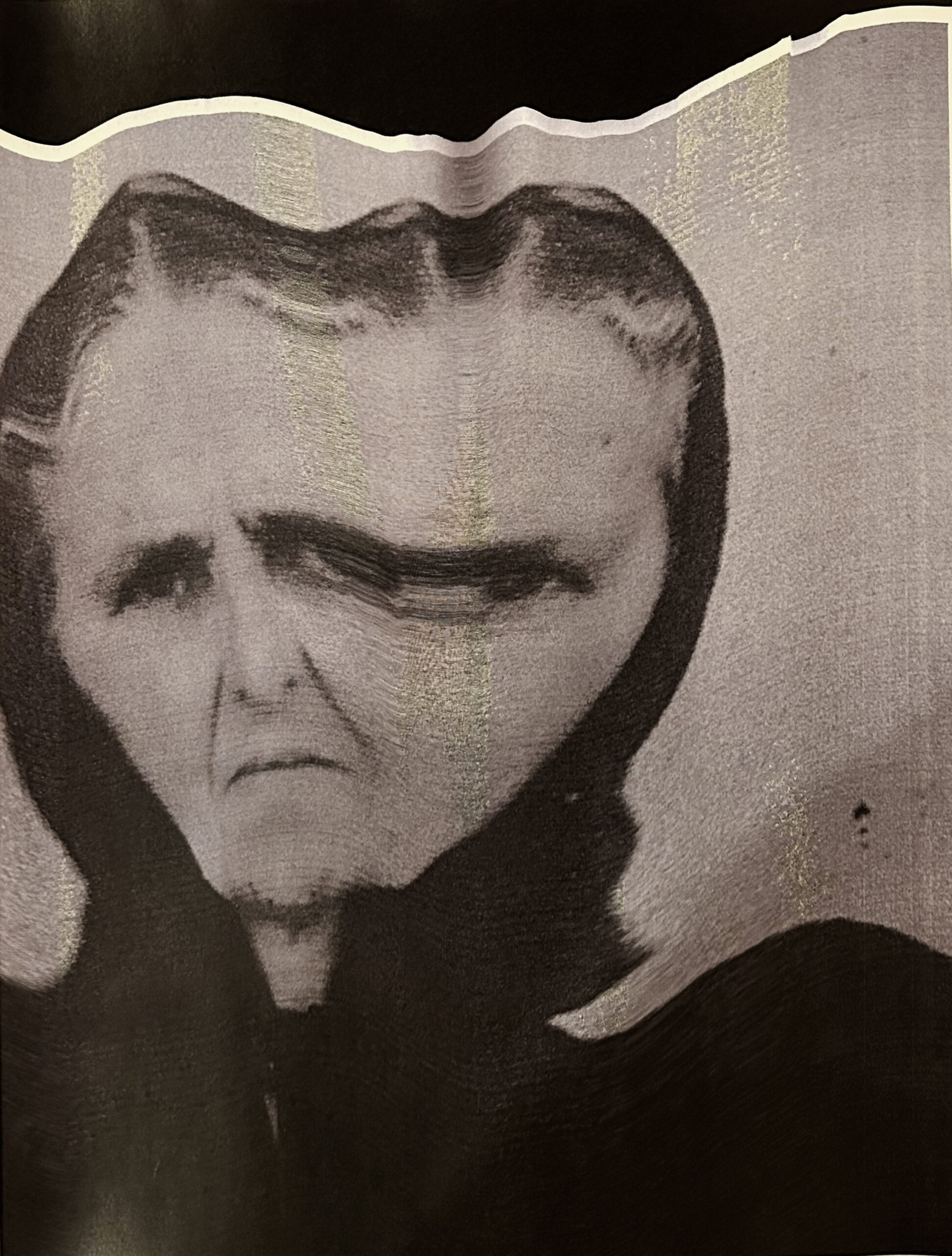 A distorted portrait of the author's grandmother. Her photo has been shifted or stretched beneath a scanner, widening and blurring her face.