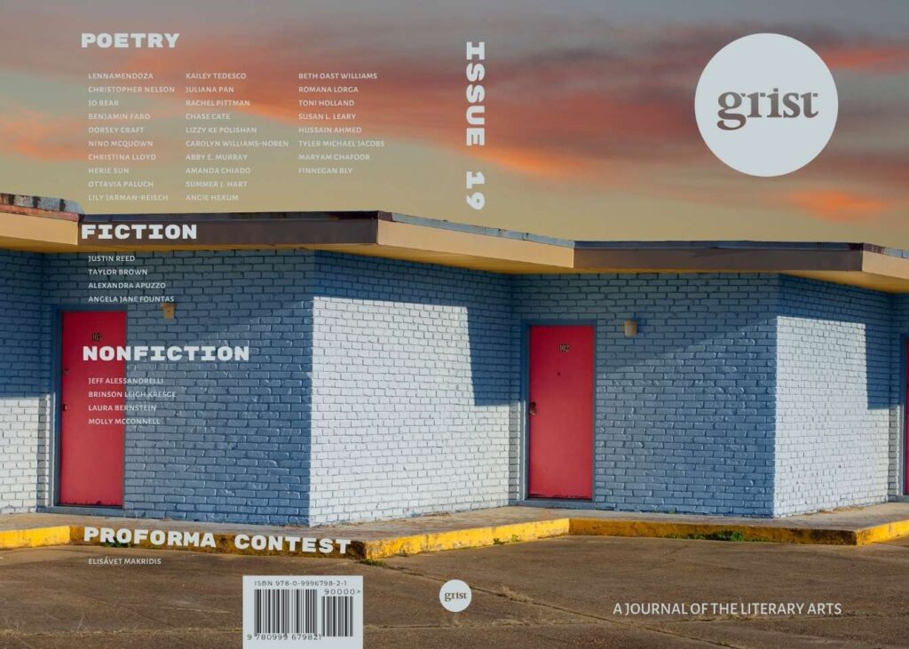 This is an image of Grist Journal's Issue 19 cover. It shows a low-slung blue brick building with red doors, like a motel. The photographer is Jacob Mitchell.